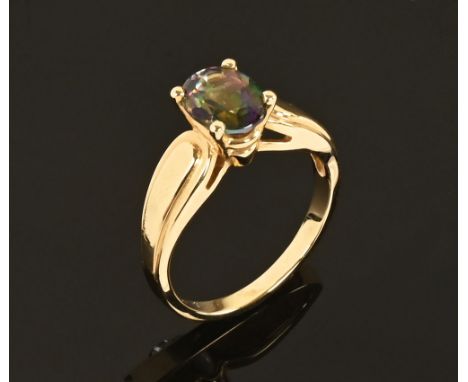 A 14 ct gold ring with oval cut stone.  Size M.