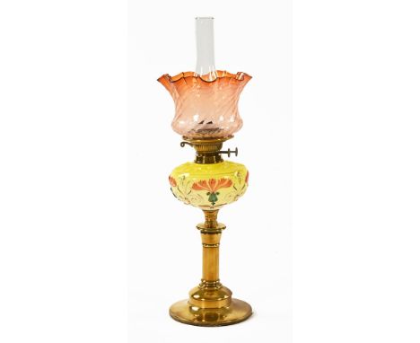 A Victorian brass oil lamp, with double wick and yellow glass reservoir, flared etched shade.   66 cm high including glass ch