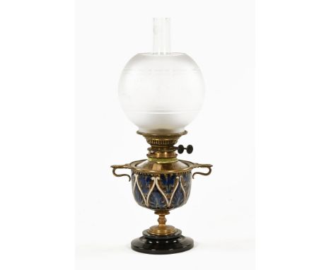 A Doulton attributed oil lamp, with lift out brass reservoir complete with chimney. CONDITION REPORT: The Doulton style ceram