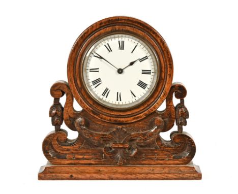 An Edwardian oak cased mantle clock, with single train movement complete with key.  Height 20 cm, width 19.5 cm. CONDITION RE
