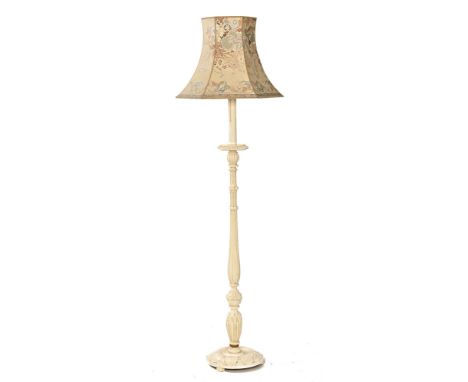 A white painted continental style lamp standard, with turned column on circular base.