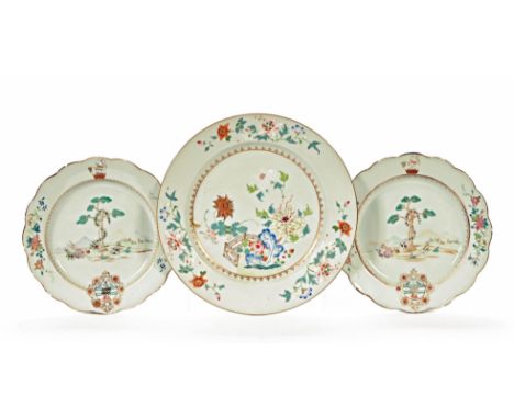 A collection of three Chinese porcelain plates Qianlong, painted in Famille Rose enamels with flowers and landscape scenes wi