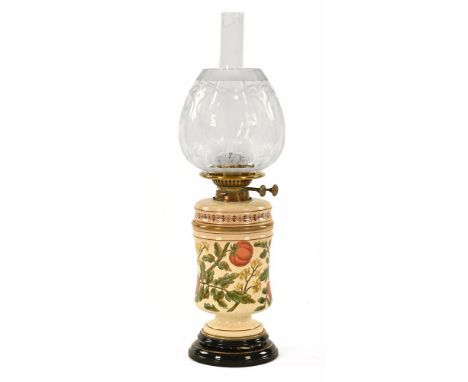A Victorian brass and ceramic oil lamp, with double wick, decorated with floral and fruit designs with chimney and etched gla