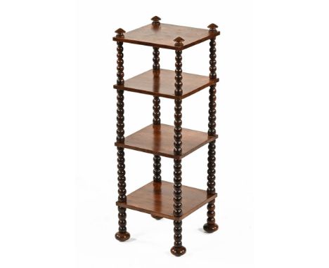 A 19th century rosewood four tier whatnot stand, with bobbin turned support between and raised on short turned legs with bun 