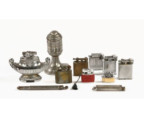A vintage Dunhill cigarette lighter and others.