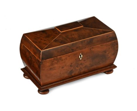 A Georgian burr yew tea caddy, with interior divisions and centre aperture.  width 31 cm (see illustration).