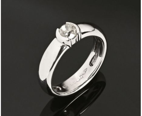 An 18 ct white gold ring with a semi rubover set old cut diamond, weighing +/- .52 carats.