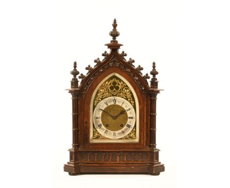 A Victorian Gothic oak bracket clock, with two train spring driven movement.  Height 58 cm, width 37 cm, depth 21 cm. CONDITI