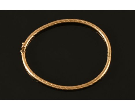 A 9 ct gold bangle.  5.9 grams.