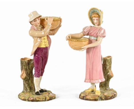 A pair of Worcester figures, each holding a basket, green printed mark.  Height 25.5 cm. CONDITION REPORT: Both figures appea