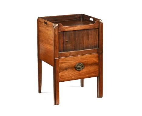 A George III mahogany bedside commode cabinet, with tambour cupboard door and commode drawer with carrying handle to either s