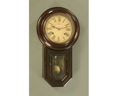 A Victorian regulator wall clock, with key and pendulum, two train.  Height 53 cm.
