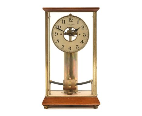 A Bulle clock Brevete patent, a skeleton turbine pendulum clock, with a 13 cm dial within a rectangular glazed case.  37.5 cm
