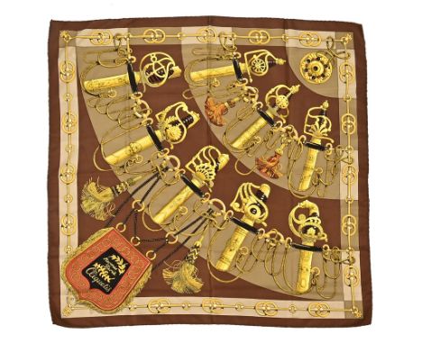 A vintage Hermes scarf, Cliquetis, with handles of swords, gold, brown and black, silk with hand stitched edges (see illustra