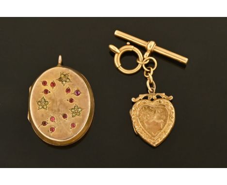 A gold coloured metal locket, set with seed pearls and ruby coloured stones, gross weight 12 grams, together with a gold colo