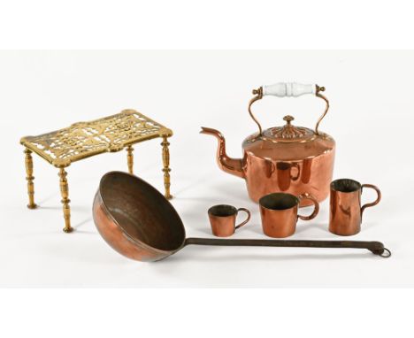 A Victorian copper kettle, a brass trivet (length 26 cm), three small copper measures and a copper and iron ladle.