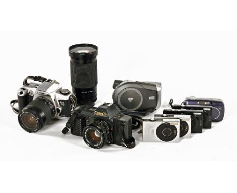 A vintage Canon T70 35 mm camera with Command back 70, together with a variety of lenses and accessories etc.