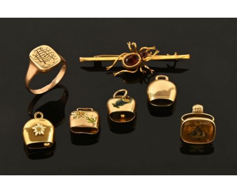 A 9 ct gold signet ring 4.5 grams, a 9 ct gold insect brooch 2.8 grams, a Victorian gold coloured seal, gross weight 5 grams,