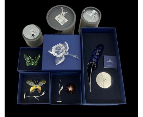 A number of Swarovski crystal flower and insect figures including 'Bumblebee' (7615 000 002) no certificate, Dindori Sapphire