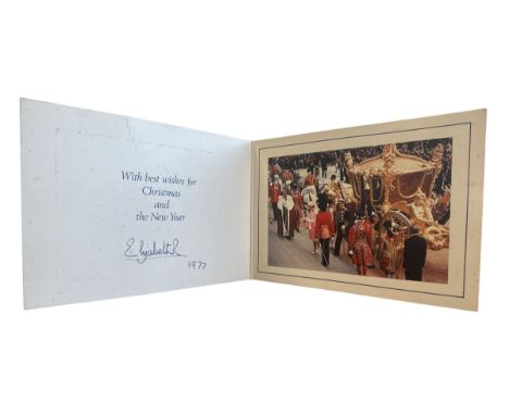 A 1977 Christmas Card sent from HM Queen Elizabeth II with embossed '1977 Silver Jubilee' crest to the cover. Interior with c