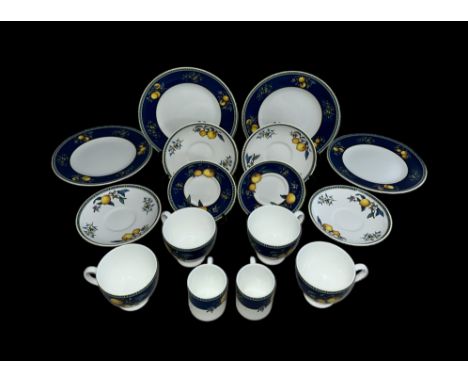 A Wedgwood Bone China Citrons (1993) part service to include; two small coffee cups and saucers, four side plates (one chippe