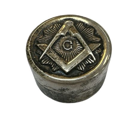 A small silver Masonic pill box with the Masonic emblem on the front. Marked 925 to base.Diameter approx. 3cm, depth 1.6cm.