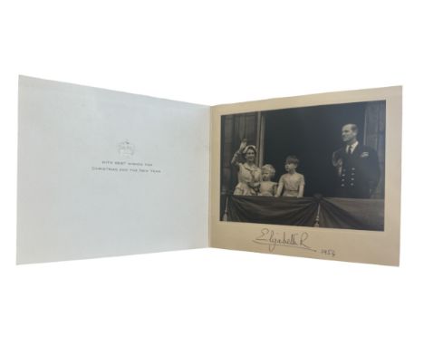 A 1954 Christmas card signed by HM Queen Elizabeth II. Gilt crown to cover, interior with a photograph of the Queen waving fr