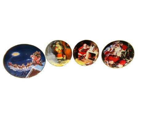 A collection of Christmas &amp; Santa themed ceramic items, with many collectable plates to include; Caverswall Christmas Pla