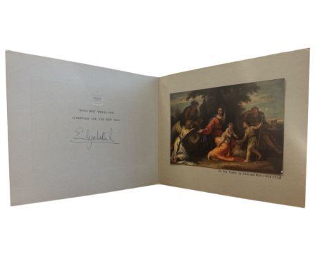 A 1958 Christmas Card sent from HM Queen Elizabeth II. Cover with a gilt crown and interior with a print of The Holy Family b