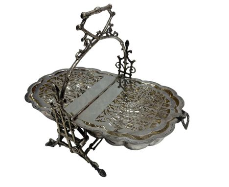 A Victorian silver plated clam shell muffin warmer by the Fenton Brothers of Sheffield. Laurel wreath loose ring handles and 