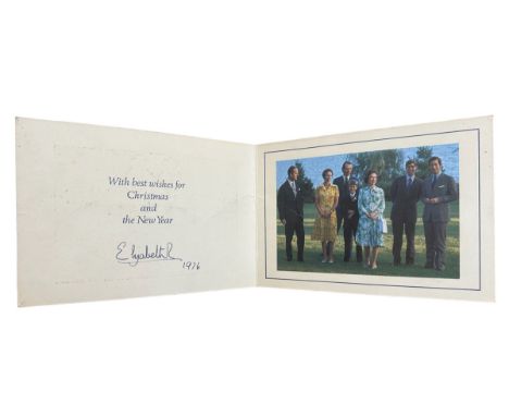 A 1976 Christmas Card from HM Queen Elizabeth II. Cover with twin gilt Royal cyphers. Interior with colour photograph of the 