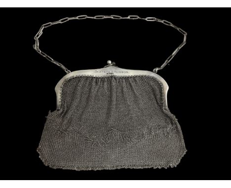 CHARITY - being sold on behalf of Acorn's children's hospice. A silver mesh evening bag with fringe detail, stamped 925 with 