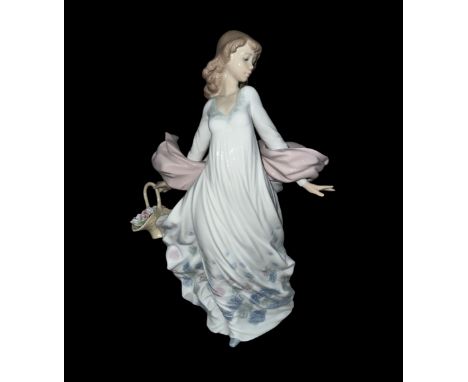 A large Lladro ‘Spring Splendor’ ceramic figurine of a lady holding a floral basket in a flowing dress. In original box, no. 