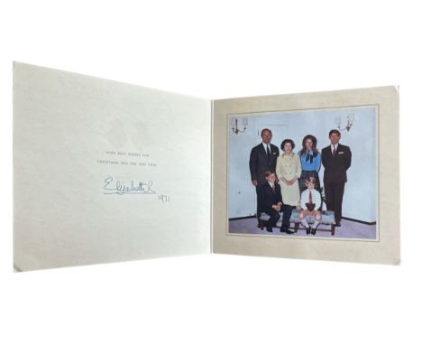 A 1971 Christmas Card from HM Queen Elizabeth II. Twin gilt Royal cyphers to the cover. Interior with a colour photograph of 
