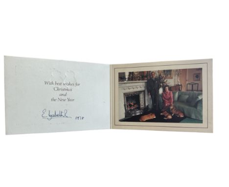 A 1978 Christmas card sent by HM The Queen. Twin gilt Royal cyphers to cover. Interior with photograph of the Queen and the D