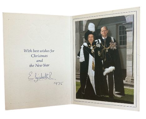 A 1975 Christmas Card from HM Queen Elizabeth. Cover with twin gilt Royal cyphers. Interior with colour photograph of the Que