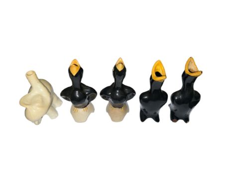 A selection of five ceramic pie funnels, to include; four black bird funnels (two stamped Made in England to interior) and a 