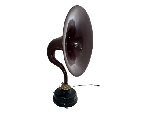 A large aluminium horn (gramophone style) shaped amplifying speaker brown/purple, circular base on four small feet, height 63