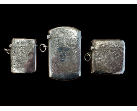 3 Silver Vesta lighters. A George V, 1914, lighter approx 63mm in length, an Edwardian lighter 1903 approx 43mm x 42mm and a 