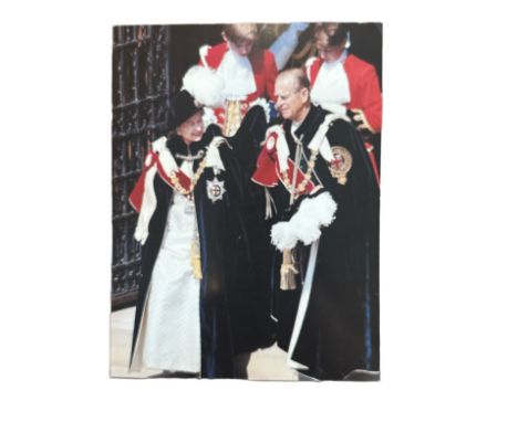 A 1991 Christmas card from HM Queen Elizabeth II. The cover is a photograph showing the Queen and The Duke of Edinburgh in ce