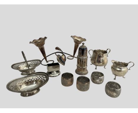 A number of silver items including two bon bon dishes with handles assayed Birmingham 1938, cream jug (small dents) and sugar