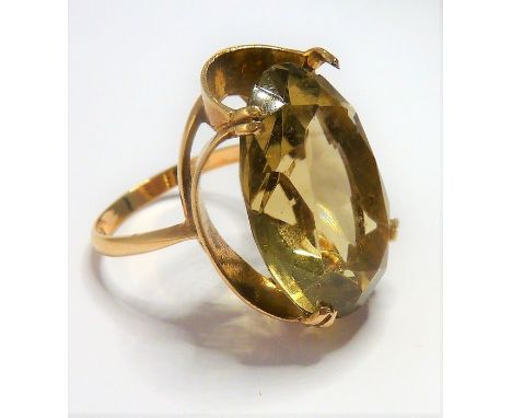 A 9-carat gold ring set with a large citrine; ring size P (total weight approx. 7.4g)&nbsp; (The cost of&nbsp;UK postage&nbsp