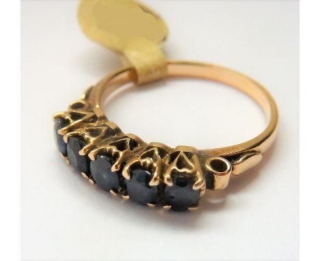 A 18-carat gold ring set with five sapphires; ring size P (total weight approx. 3.29g) (The cost of&nbsp;UK postage&nbsp;via 