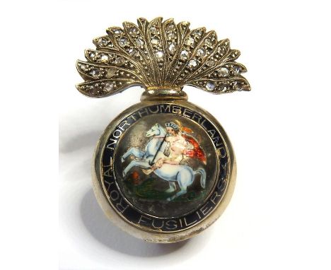 An enamel and diamond-set regimental brooch for the Royal Northumberland Fusiliers; the grenade with regimental name&nbsp;in 