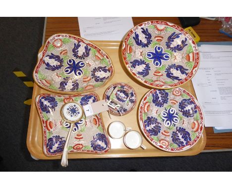 An early 20th century Wedgwood part dessert service; comprising circular comport, two leaf-shaped dishes, two further slightl
