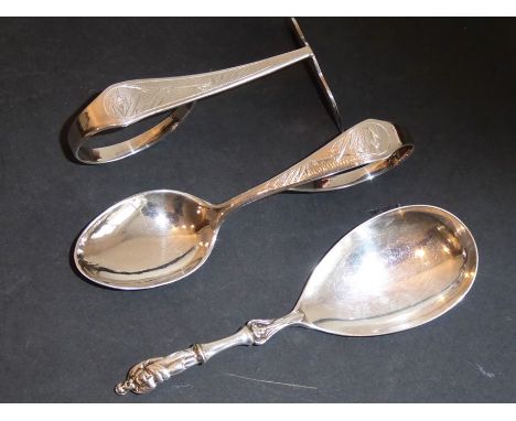 An Orientalist silver spoon and pusher set marked TuckChang sterling and engraved with bamboo stems and leaves, together with