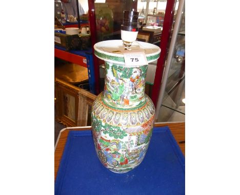 An unusual Chinese enamelled vase (as a lamp); unusually decorated with a highly enamelled scene of a dignitary in a wheelcha