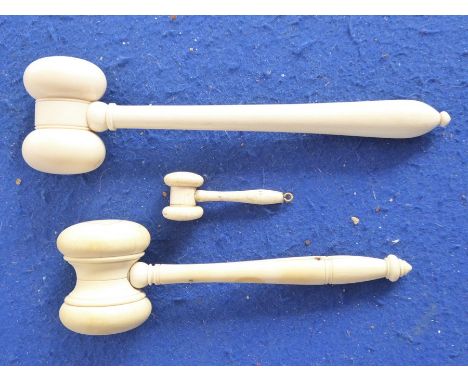 Three late 19th/early 20th century turned ivory auctioneer's gavels (the largest 16.5cm, the miniature gavel 5cm)  The condit