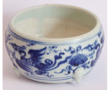 A Yuan Dynasty blue-and-white Chinese three-footed porcelain censer decorated with three phoenix (one foot with historic chip