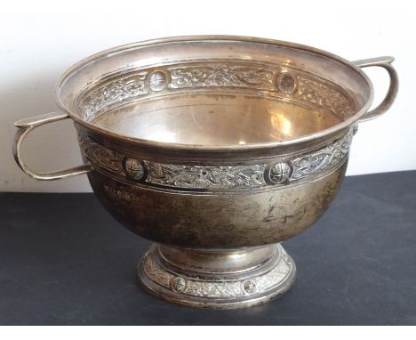 A hallmarked silver two-handled pedestal bowl decorated with a Celtic-style band below the averted rim, on spreading circular